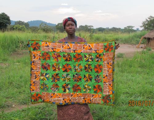 #213 A nice wallhanging or table cover from our newest members.