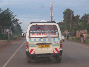 Learning to figure out the taxi service. It is the most economical way to get around Kampala.